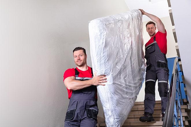 hauling away an old box spring for disposal in Cheltenham